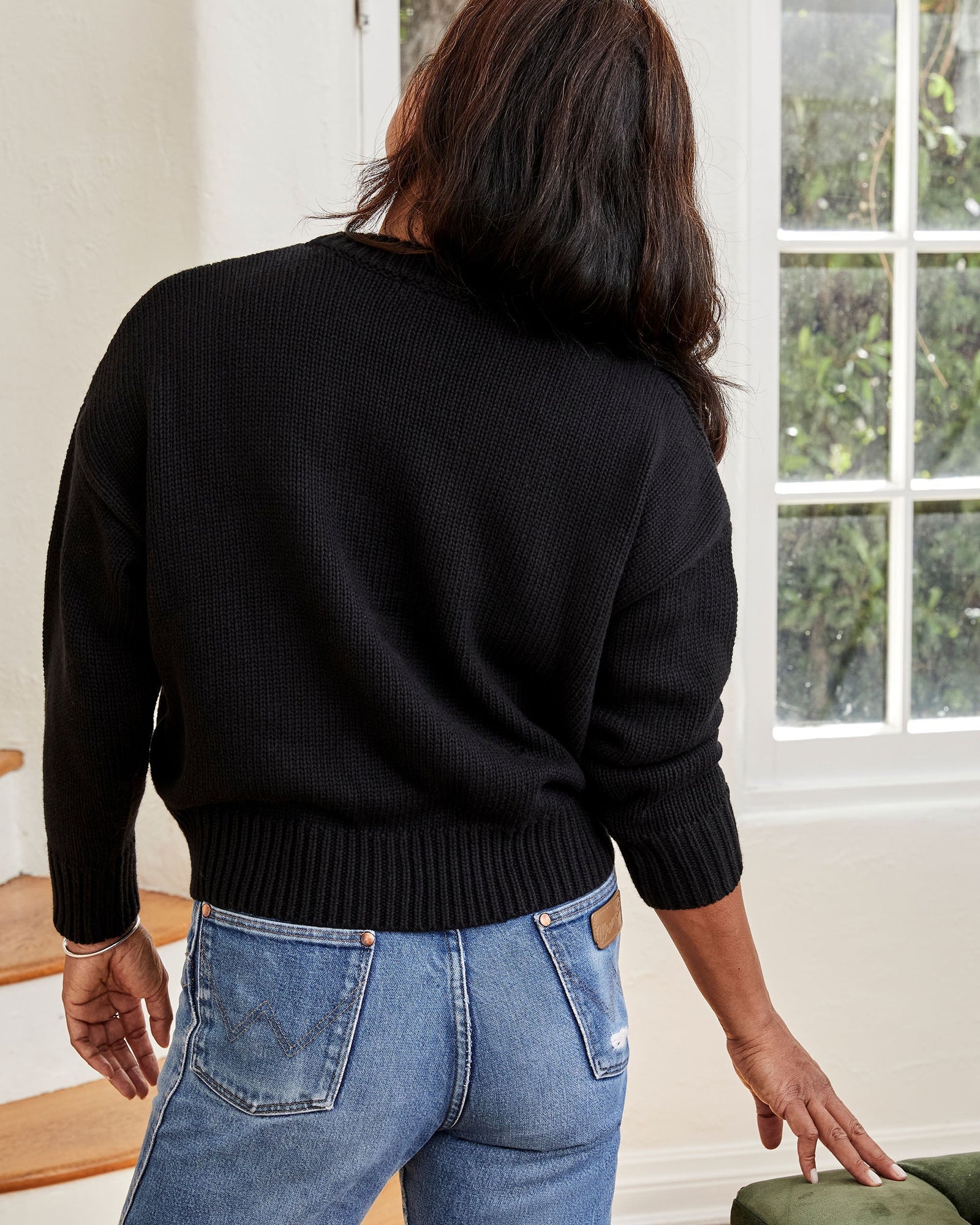Back View of Joanna Wearing the Black w/ Cream Ciao Cotton-Cashmere Drop Shoulder Sweater 