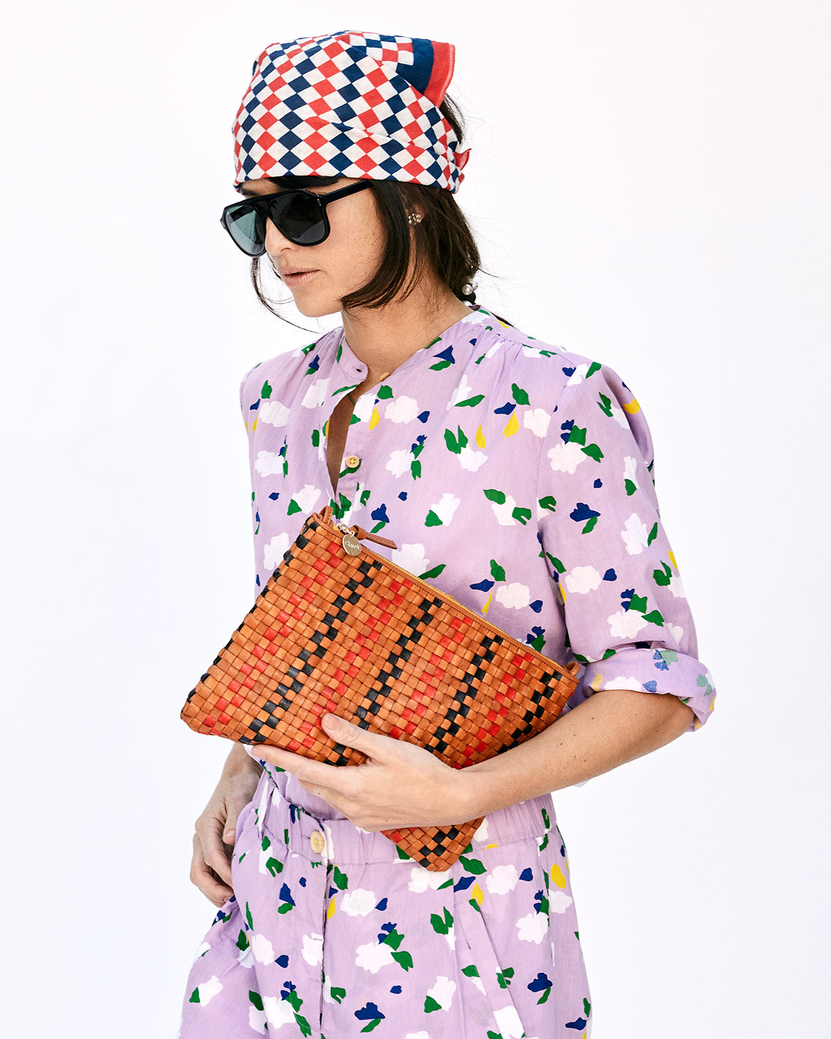 Danica, in the Lavender St. Martin Top Holding the Natural with Navy & Red Pinstripe Woven Checker Flat Clutch w/ Tabs