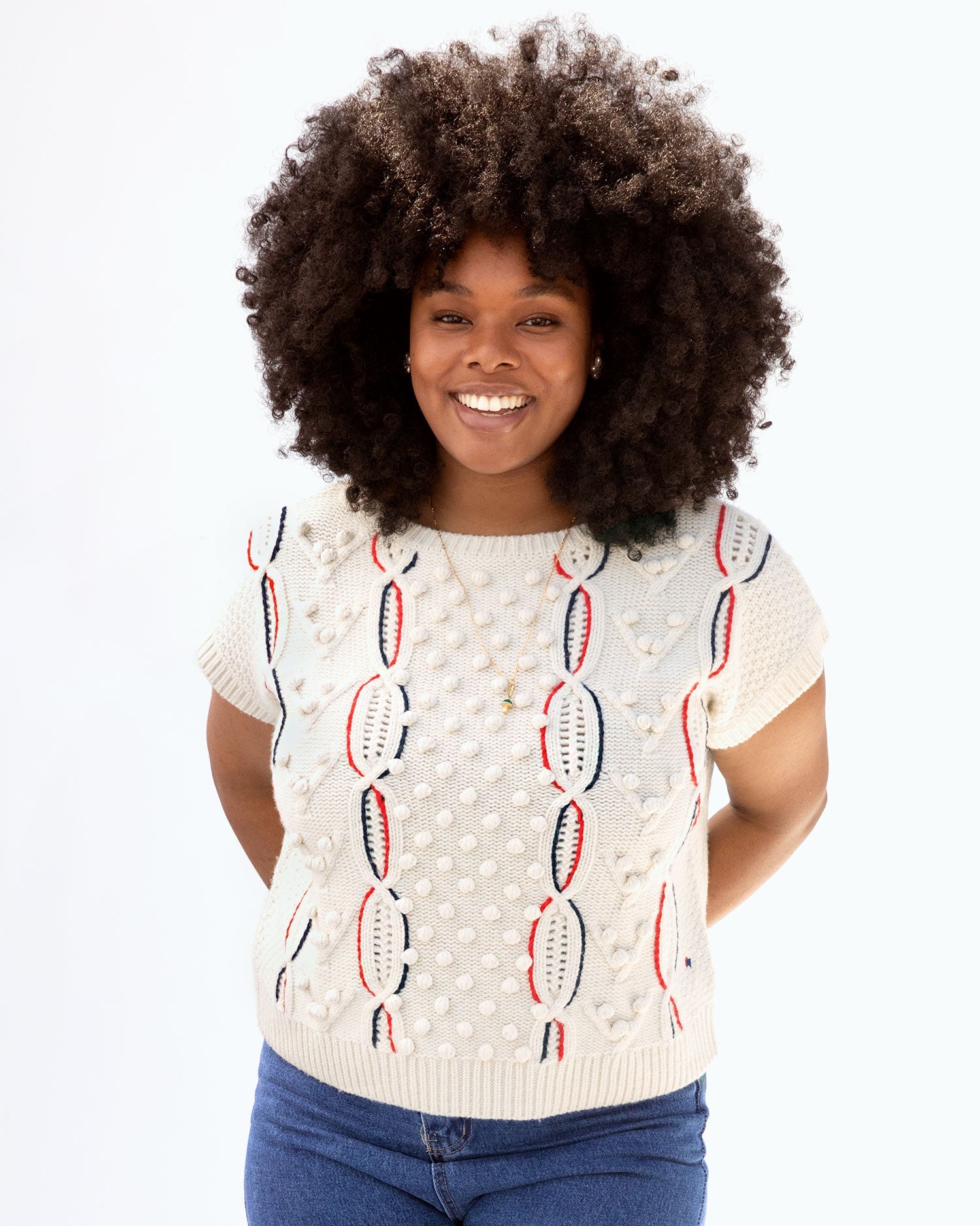 Candace wearing the cream w/ chains Odette Sweater Vest with jeans