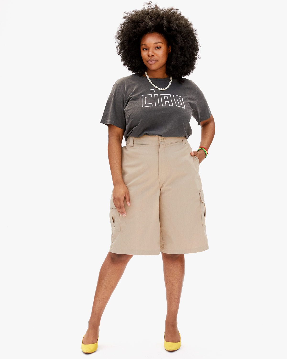 Candace in Tan Long Shorts with the Faded Black with Ciao Original Tee Tucked In