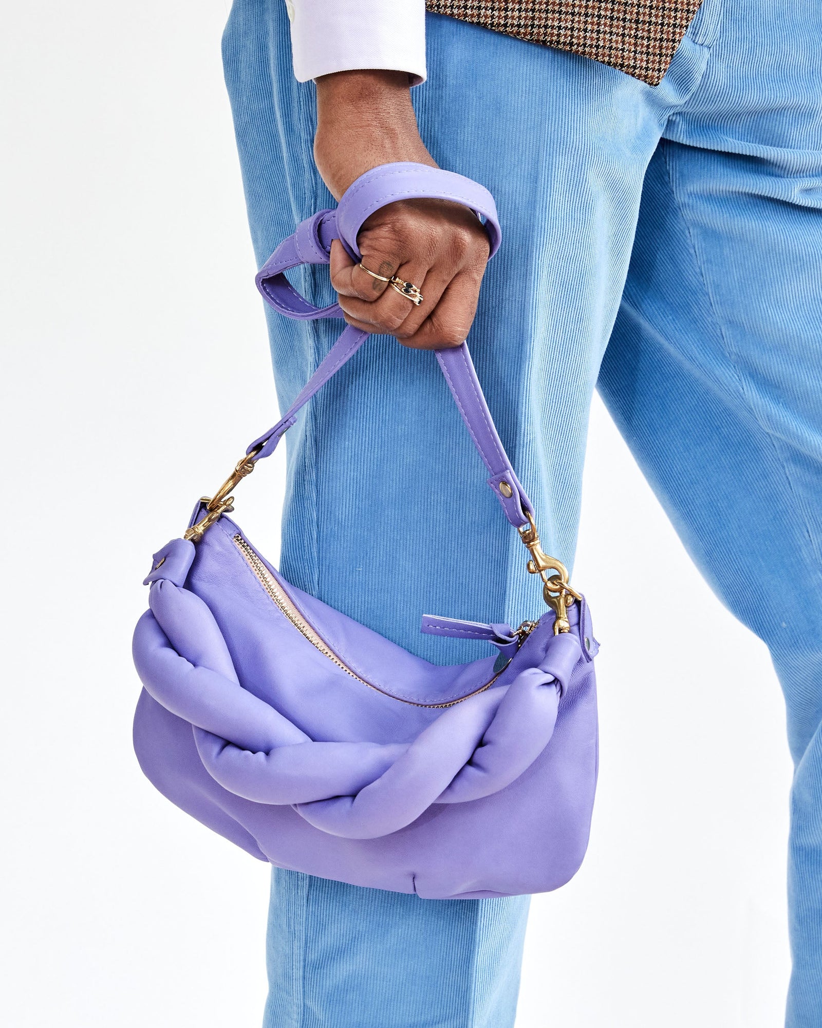 Mecca Holding the Violet Petit Moyen by Crossbody Strap with Added Violet Twisted Puff Top Handle