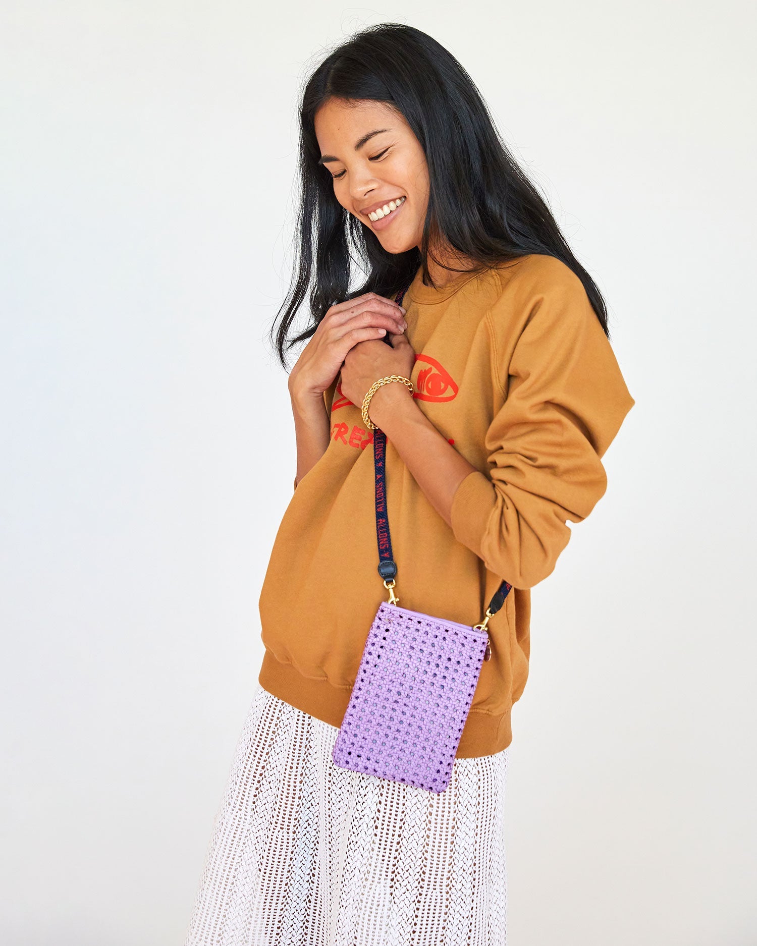 sandra wearing the Lilac Rattan Poche over the camel liberez les sardines sweatshirt
