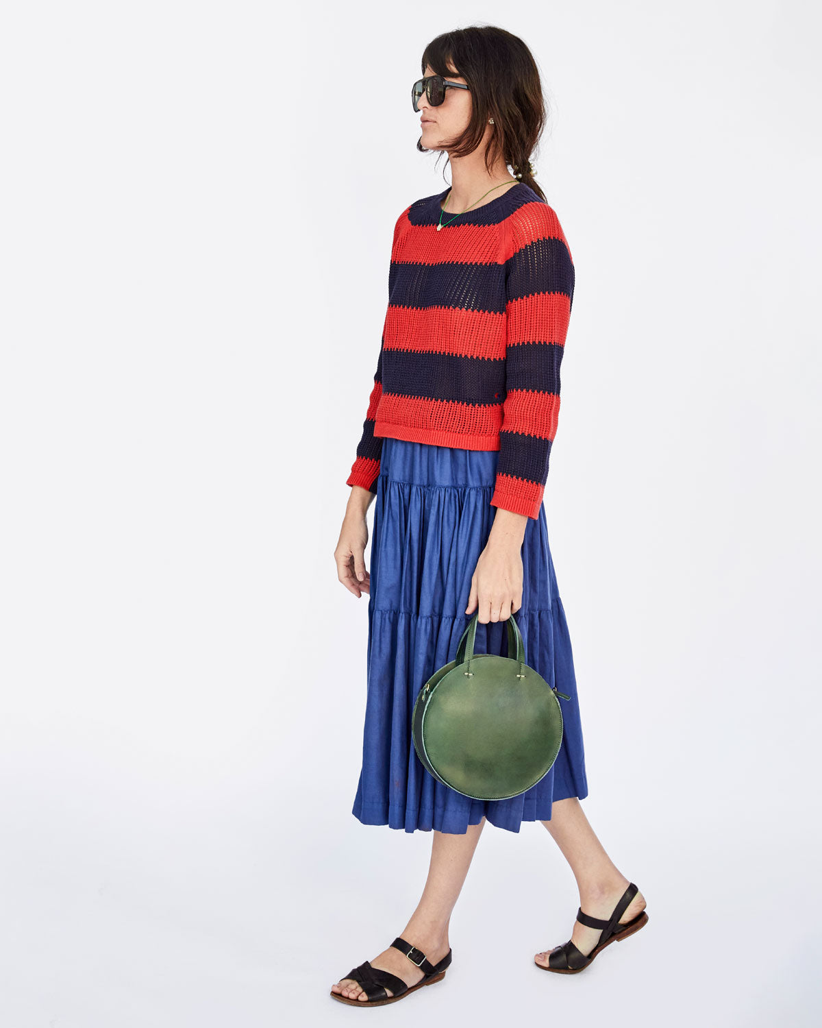 Danica in the Navy & Poppy Striped Open Weave Raglan Sweater with the Loden Petit Alistair and a Blue Skirt