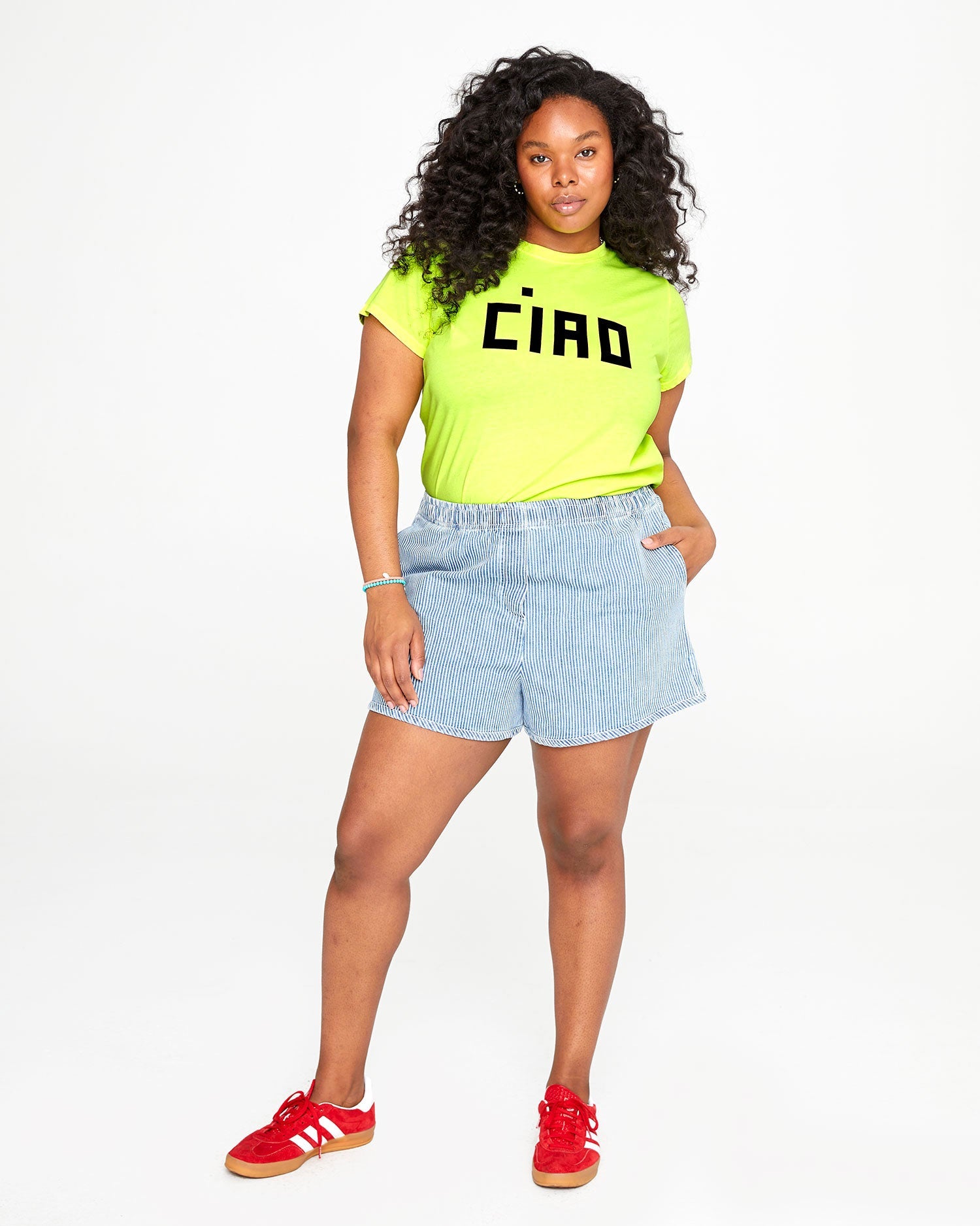 candice wearing the engineer stripe st martin shorts with the neon yellow ciao tee