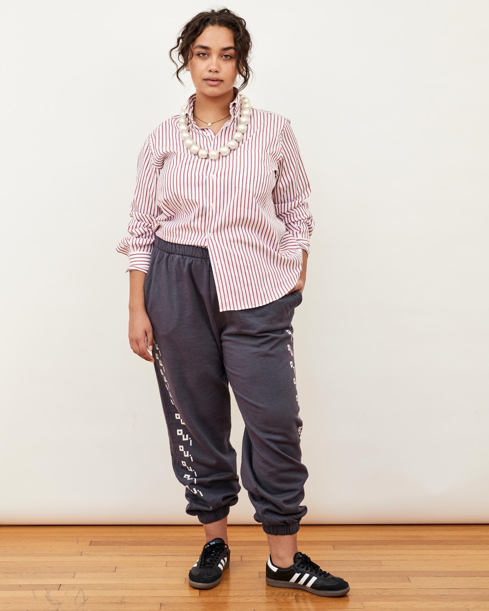 Claudia Wearing the Chilli Stripe Single Needle CV x Steven Alan Shirt with the Charcoal Oui Sweatpants