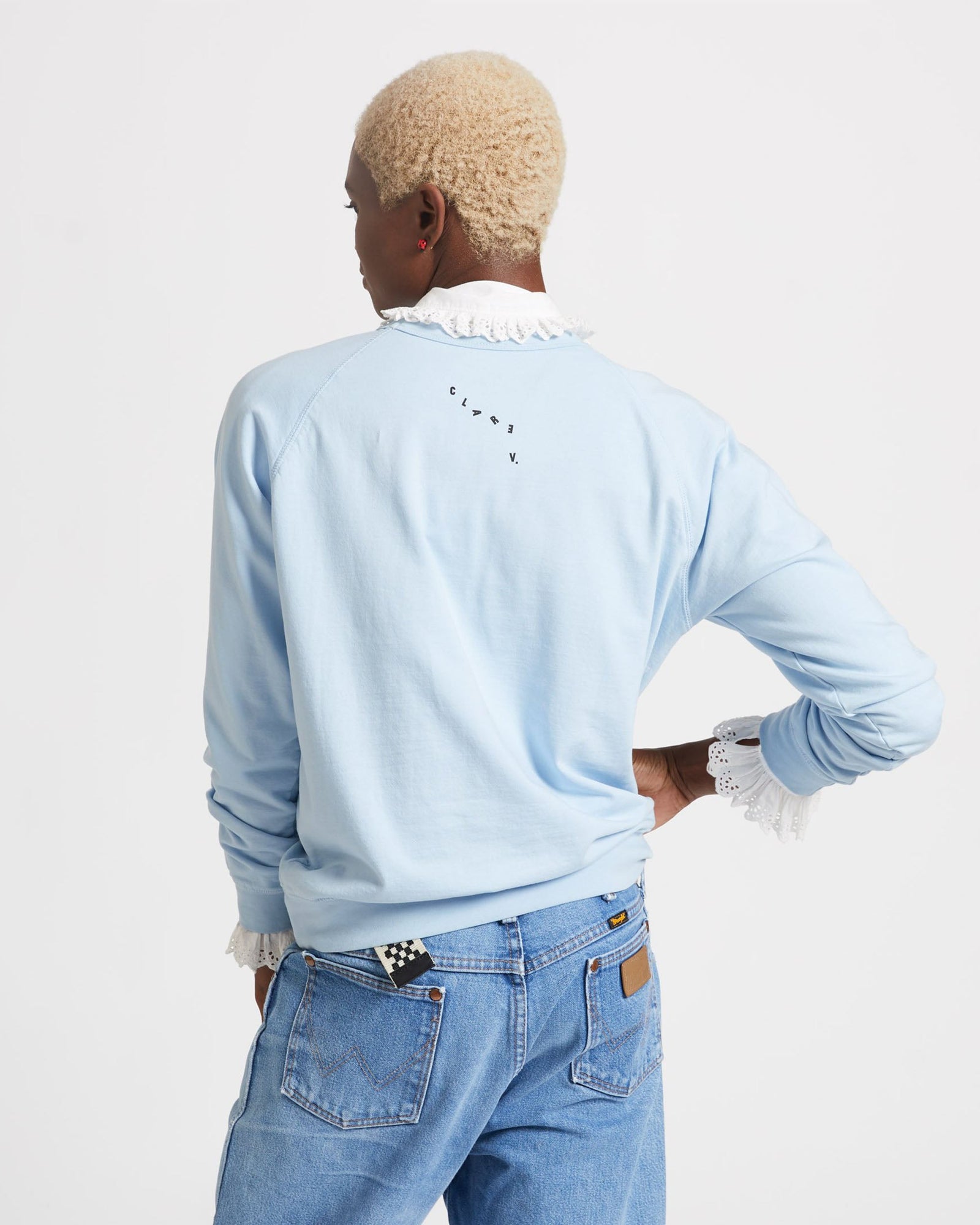 Back View of the Light Blue with Black Embroidered Charmant Sweatshirt on Kimberlee